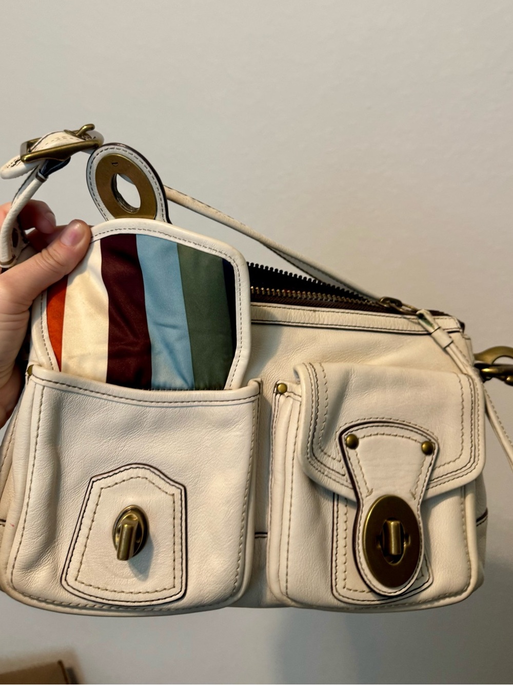 White vintage coach double turn lock legacy with 65th anniversary striped lining
